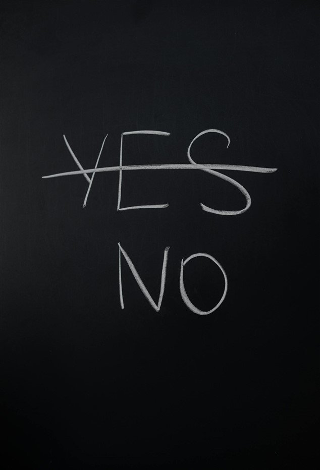 Tableau représentant un NO sous un YES barré, pour illustrer l'importance d'apprendre à dire non face à une surcharge de travail chronique ou des objectifs irréalisables
